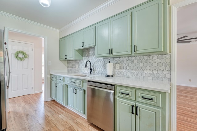 233 Summerfield, Moore, SC 29369 - kitchen featuring stainless steel appliances, green cabinets, light wood-style floors, light countertops, and ornamental molding