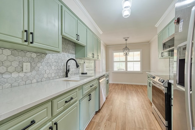 233 Summerfield, Moore, SC 29369 - kitchen featuring green cabinets, appliances with stainless steel finishes, light wood-style flooring, light countertops, and ornamental molding