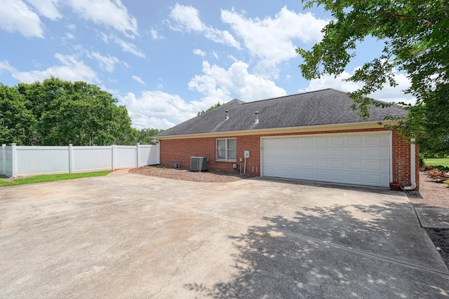 233 Summerfield, Moore, SC 29369 - view of home's exterior featuring brick siding, concrete driveway, an attached garage, and a shingled roof