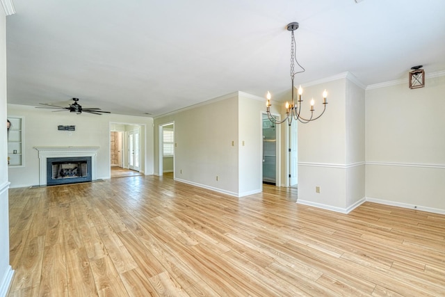 233 Summerfield, Moore, SC 29369 - unfurnished living room featuring a chandelier, light wood-style floors, ceiling fan, crown molding, and a fireplace