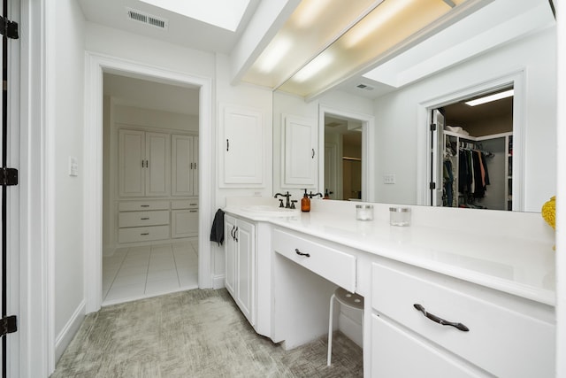 403 Barrington Park, Greer, SC 29650 - bathroom featuring vanity, a walk in closet, and tile patterned flooring