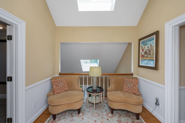 403 Barrington Park, Greer, SC 29650 - living area featuring a skylight, vaulted ceiling, wood finished floors, and wainscoting