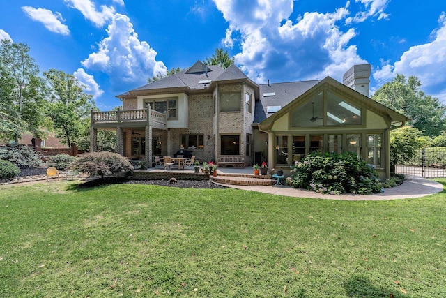 403 Barrington Park, Greer, SC 29650 - back of property with a balcony, a patio, a ceiling fan, brick siding, and a chimney