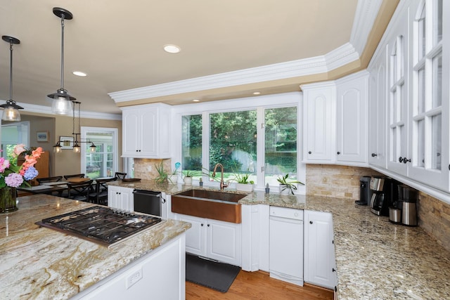 403 Barrington Park, Greer, SC 29650 - kitchen with stainless steel gas stovetop, ornamental molding, white cabinetry, tasteful backsplash, and light stone countertops