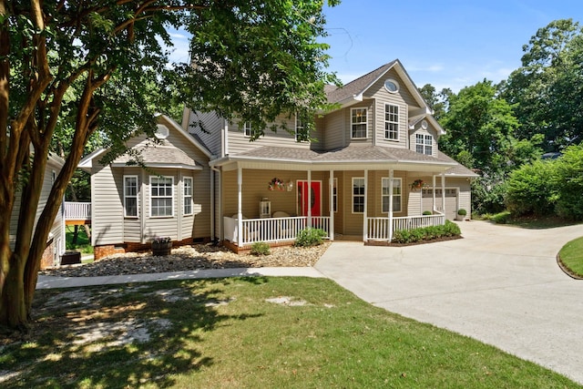 436 S Lakeview, Duncan, SC 29334 - view of front facade featuring a porch, concrete driveway, a shingled roof, a garage, and a front lawn