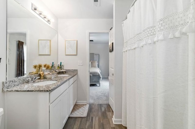 226 Christopher St, Duncan, SC 29334 - ensuite bathroom with wood finished floors and double vanity