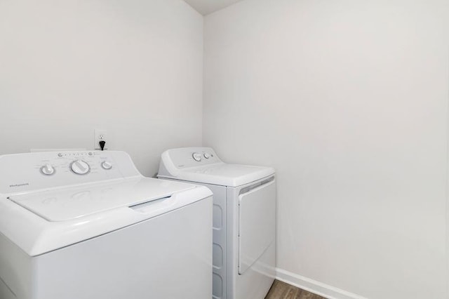 226 Christopher St, Duncan, SC 29334 - laundry area with washer and clothes dryer and wood finished floors