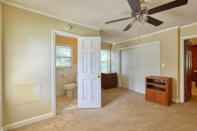 104 Pine, Laurens, SC 29360 - unfurnished bedroom with crown molding, a closet, carpet flooring, ensuite bathroom, and ceiling fan