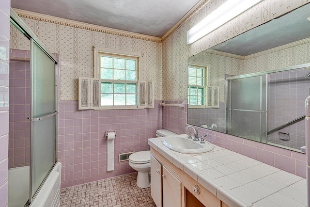 104 Pine, Laurens, SC 29360 - full bath featuring wallpapered walls, tile patterned floors, vanity, wainscoting, and bath / shower combo with glass door