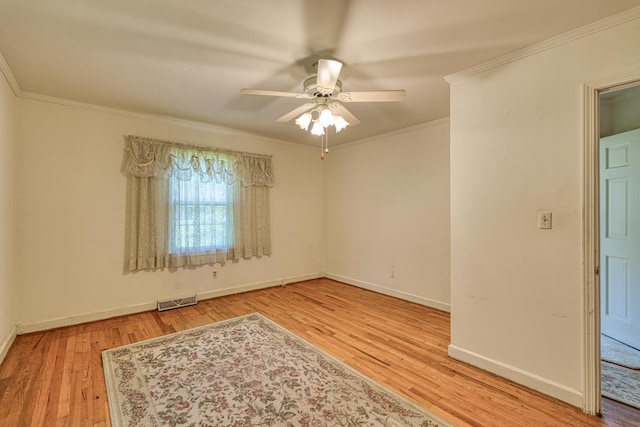 104 Pine, Laurens, SC 29360 - empty room featuring wood finished floors, a ceiling fan, and ornamental molding
