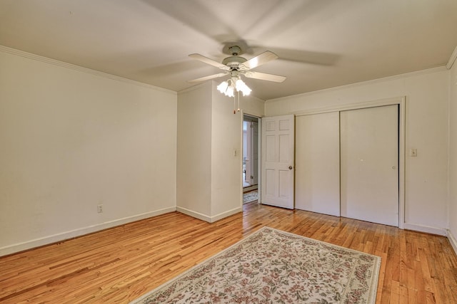 104 Pine, Laurens, SC 29360 - unfurnished bedroom with hardwood / wood-style flooring, crown molding, a closet, and ceiling fan
