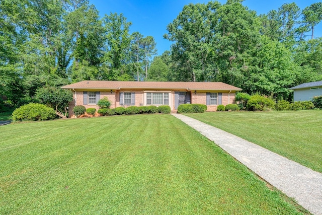104 Pine, Laurens, SC 29360 - ranch-style home featuring brick siding and a front lawn