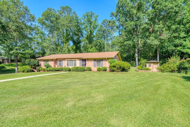 104 Pine, Laurens, SC 29360 - single story home with a front lawn, brick siding, and an outdoor structure