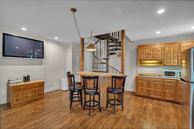 207 Carolina Club Dr, Spartanburg, SC 29306 - dining room featuring ornamental molding, wood finished floors, stairs, and recessed lighting
