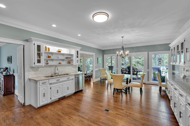207 Carolina Club Dr, Spartanburg, SC 29306 - dining space with a chandelier, plenty of natural light, recessed lighting, dark wood-type flooring, and bar with sink