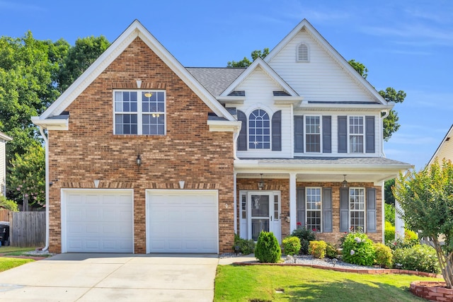 8 Glenbow, Simpsonville, SC 29680 - traditional-style house with a garage, concrete driveway, brick siding, and a porch