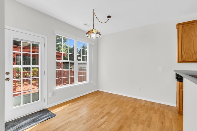 8 Glenbow, Simpsonville, SC 29680 - unfurnished dining area with light wood finished floors and baseboards
