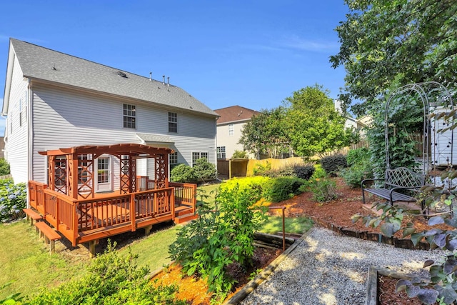 8 Glenbow, Simpsonville, SC 29680 - back of property featuring a deck, a vegetable garden, and roof with shingles