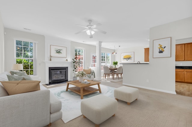 8 Glenbow, Simpsonville, SC 29680 - living room featuring a fireplace with flush hearth, ceiling fan, and light colored carpet