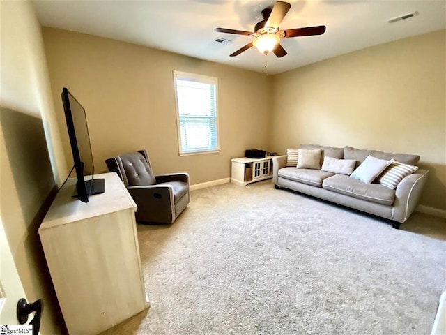 living room featuring light colored carpet and ceiling fan