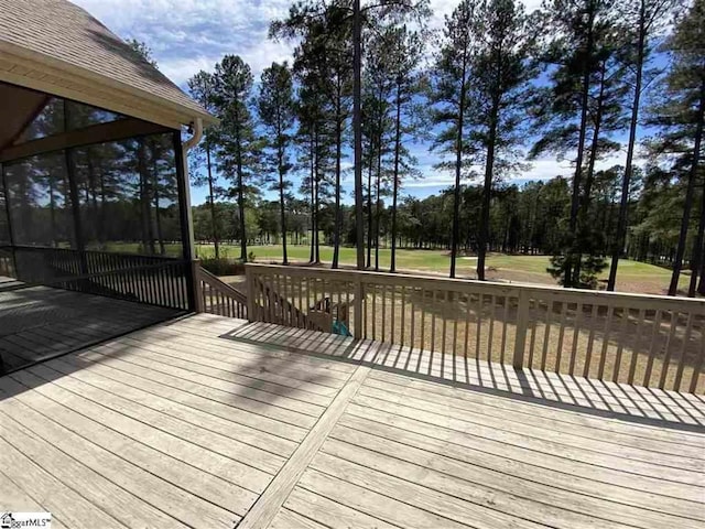 wooden terrace with a yard