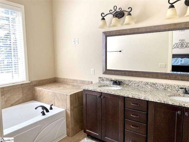 bathroom featuring double vanity, a washtub, and tile flooring