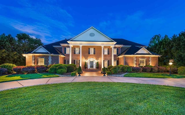 neoclassical / greek revival house with a lawn