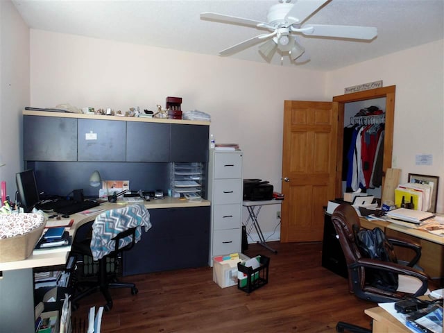 office with ceiling fan and dark wood-type flooring