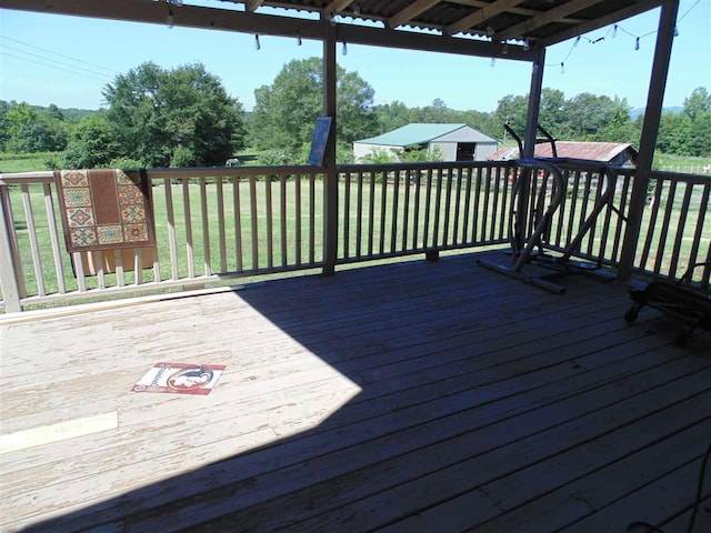 deck featuring a lawn