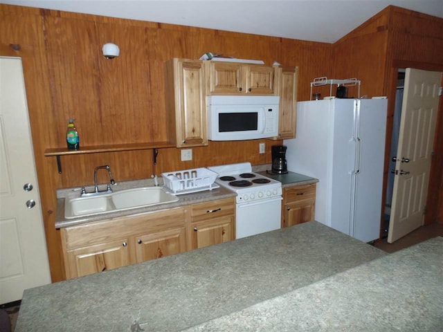 kitchen featuring white appliances and sink