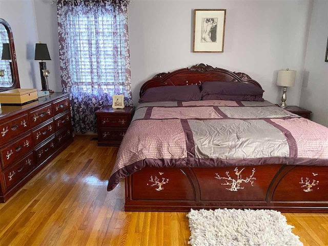 bedroom with light hardwood / wood-style flooring