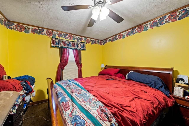 carpeted bedroom with ceiling fan and a textured ceiling