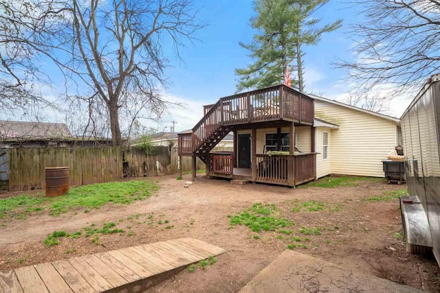 back of house featuring a wooden deck