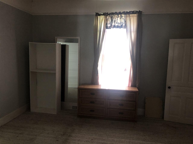 unfurnished bedroom featuring dark colored carpet