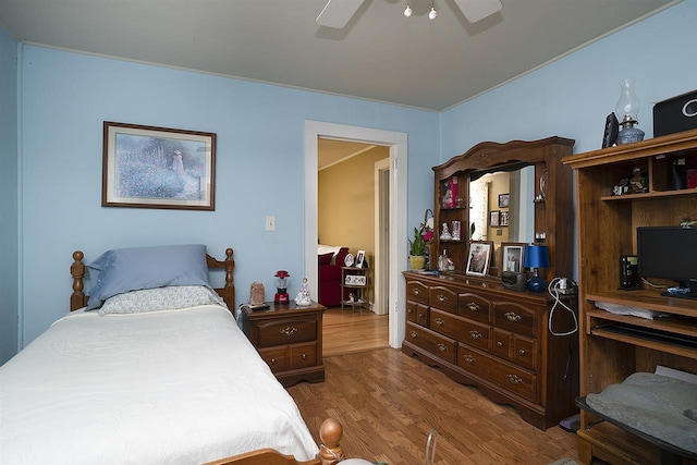 bedroom with ceiling fan and dark wood-type flooring