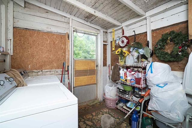 laundry room with washing machine and dryer and wood ceiling