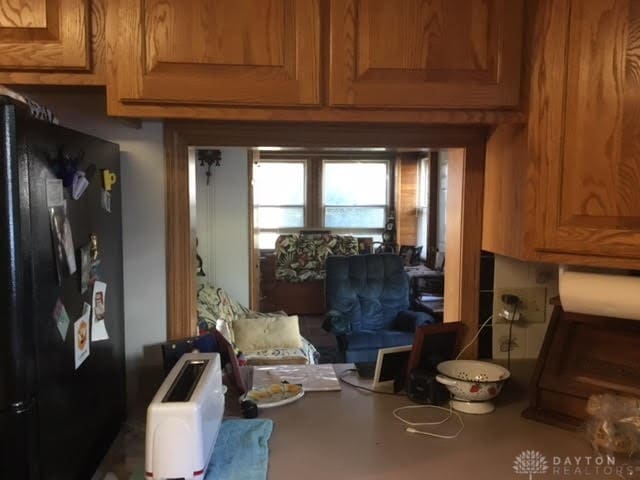 interior space with black fridge