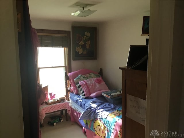 bedroom with multiple windows and ceiling fan