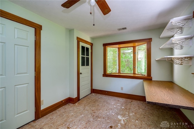 unfurnished room with ceiling fan