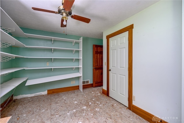 storage room with ceiling fan