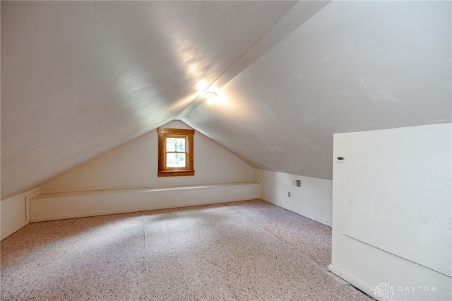 bonus room with vaulted ceiling