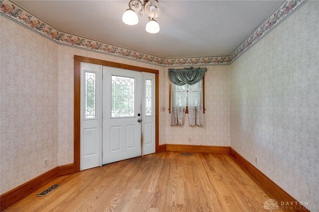 entrance foyer with light hardwood / wood-style floors