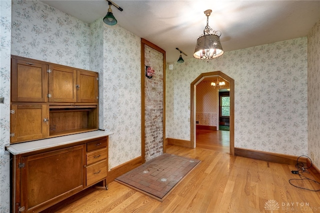 interior space with light hardwood / wood-style flooring and a chandelier