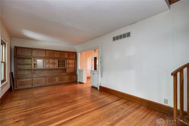 unfurnished bedroom featuring hardwood / wood-style flooring