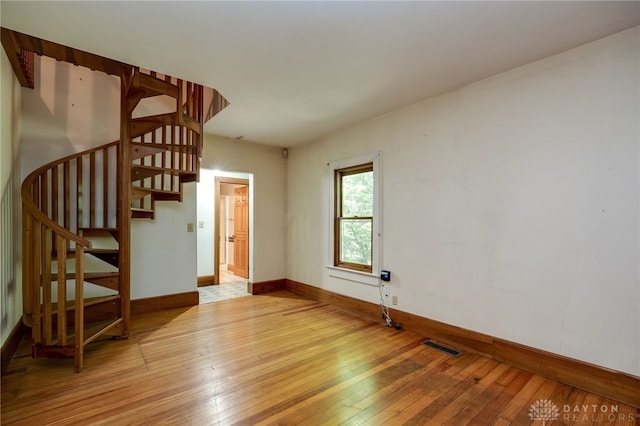 unfurnished living room featuring light hardwood / wood-style floors