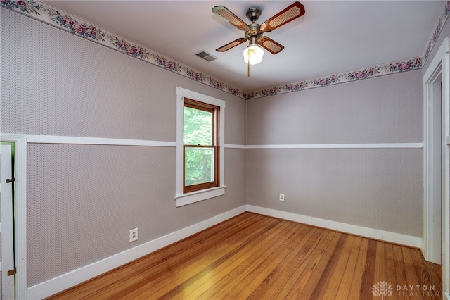 unfurnished room with wood-type flooring and ceiling fan