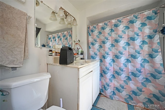 bathroom with toilet and vanity