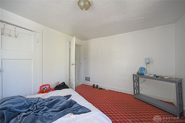 bedroom featuring dark carpet