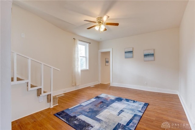 216 S Short St, Troy, OH 45373 - entryway featuring ceiling fan, wood finished floors, stairway, and baseboards