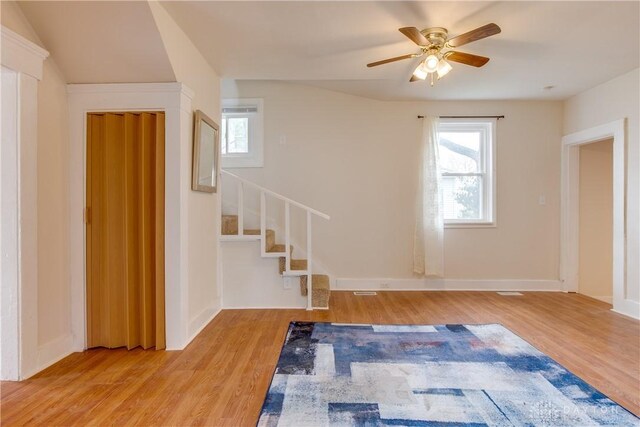 216 S Short St, Troy, OH 45373 - foyer featuring stairs, wood finished floors, a ceiling fan, and baseboards